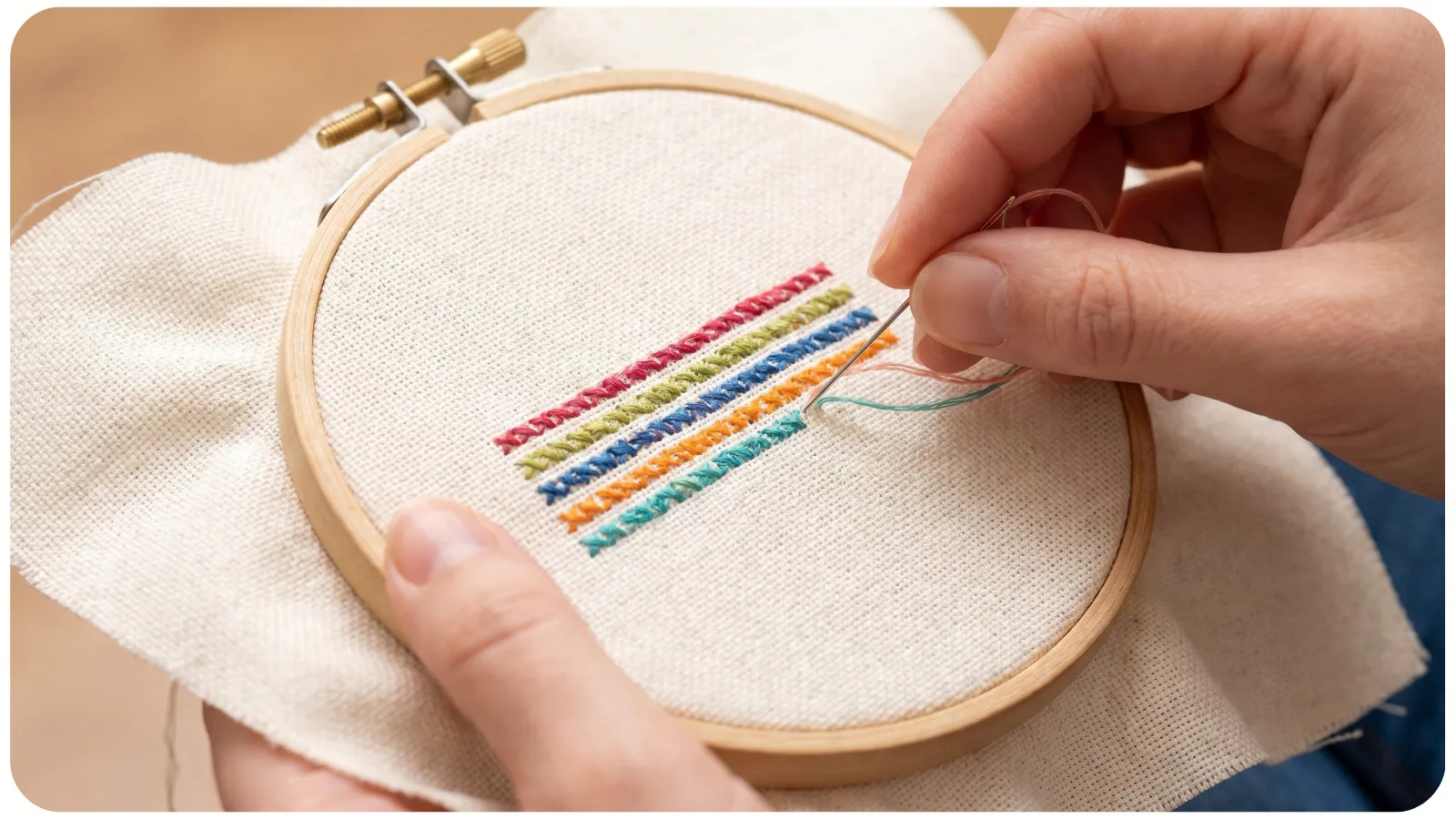 Adjusting tension on a wooden cross-stitch hoop