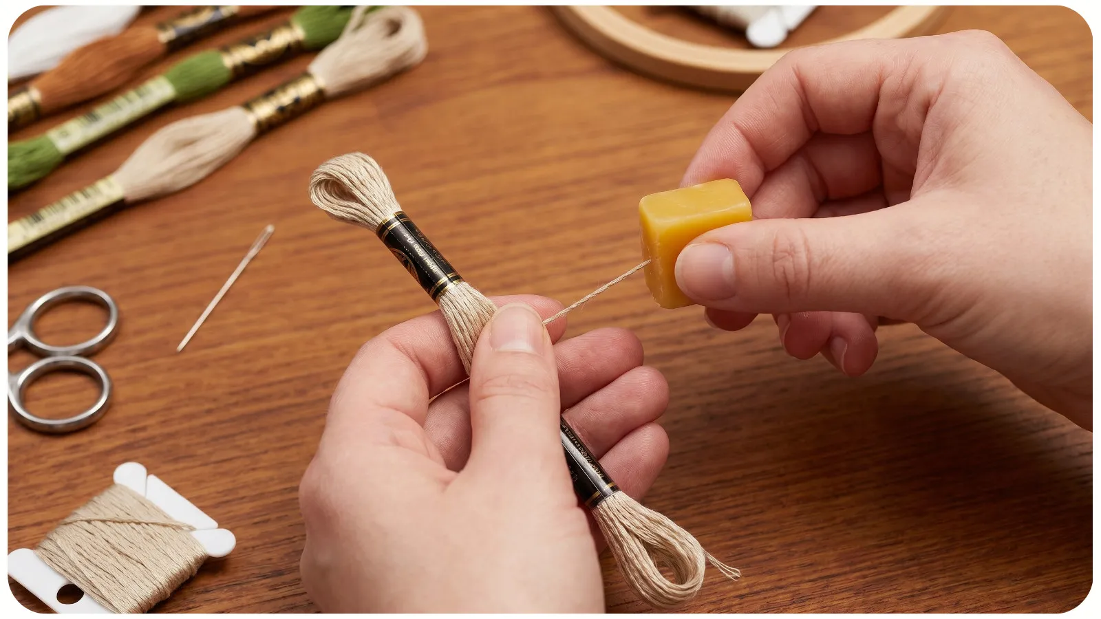 Applying thread conditioner to cross-stitch floss